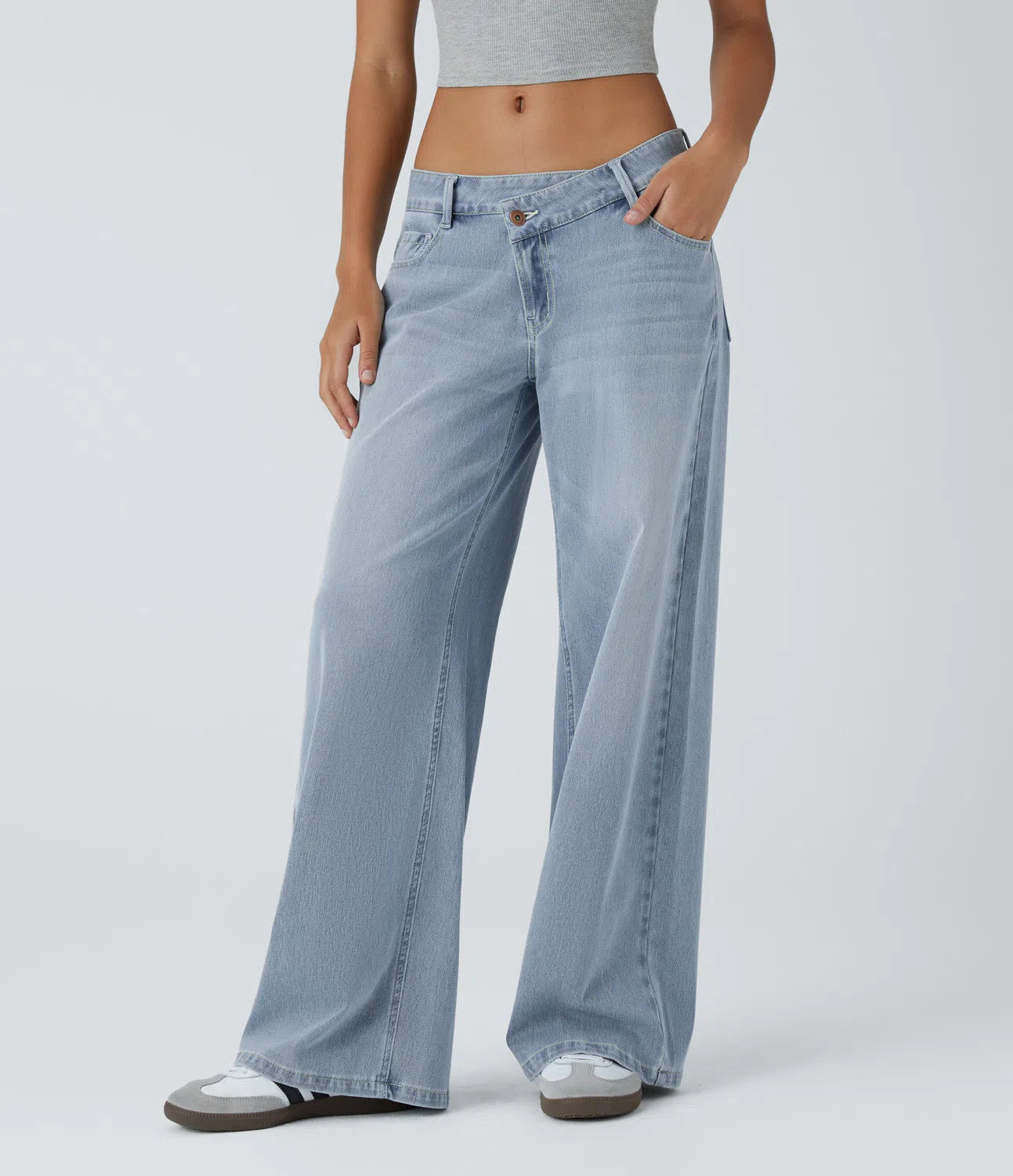 Baggy Flex™ - Jeans casuales anchos de lavado desgastado, tiro bajo, y diseño asimétrico.