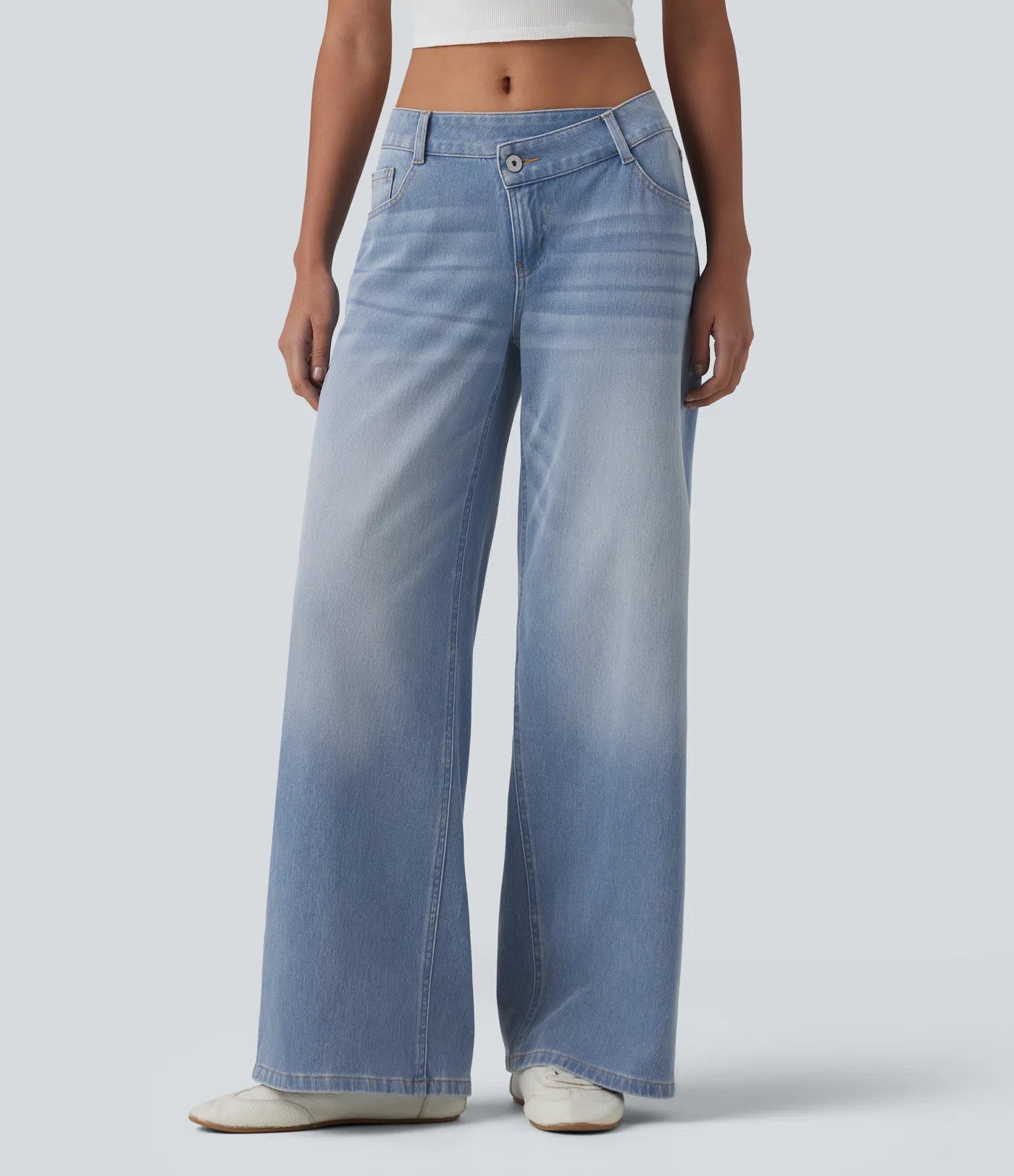 Baggy Flex™ - Jeans casuales anchos de lavado desgastado, tiro bajo, y diseño asimétrico.