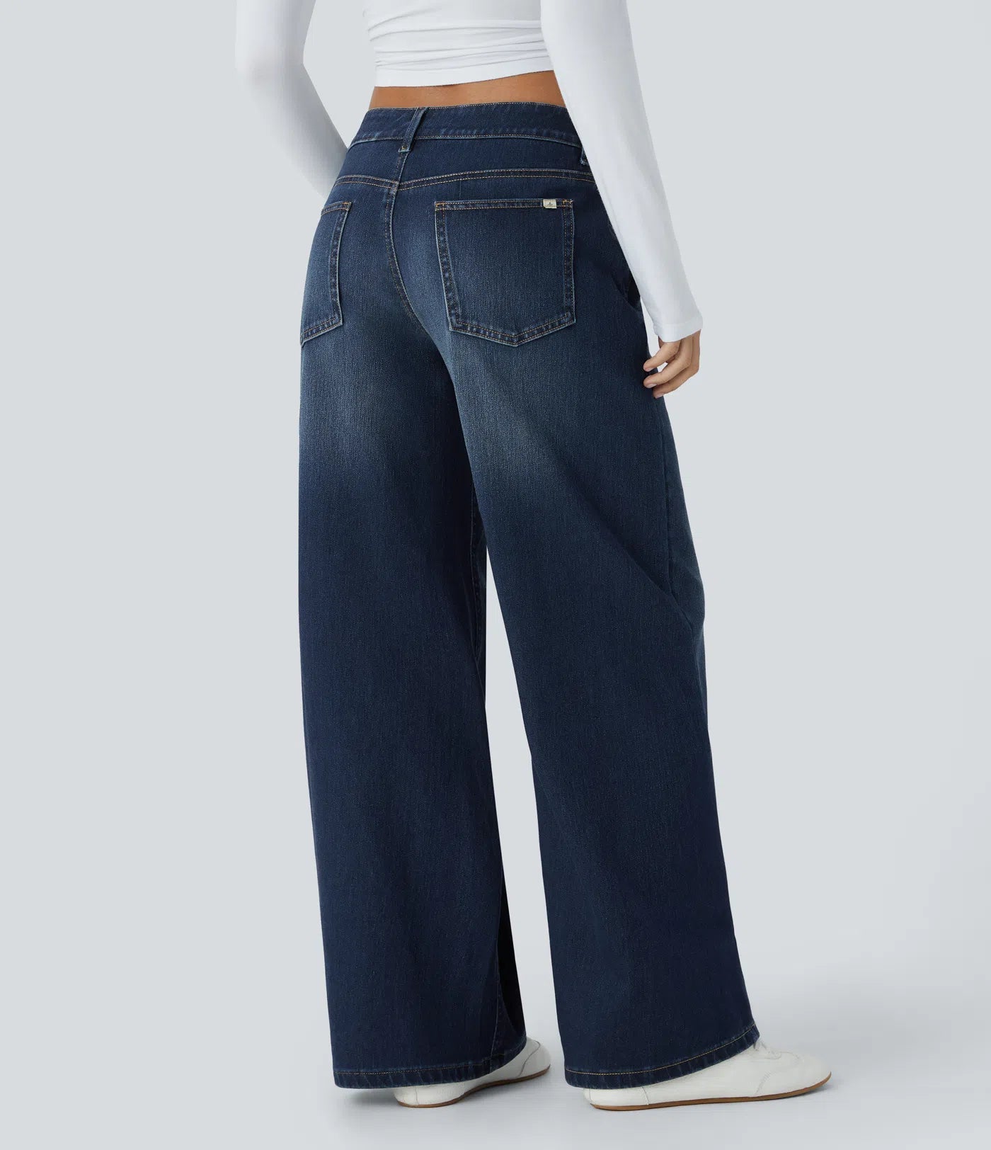Baggy Flex™ - Jeans casuales anchos de lavado desgastado, tiro bajo, y diseño asimétrico.