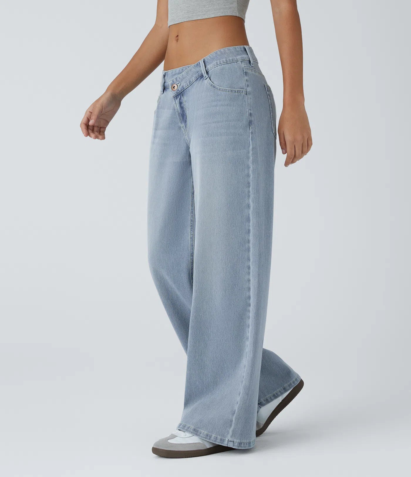 Baggy Flex™ - Jeans casuales anchos de lavado desgastado, tiro bajo, y diseño asimétrico.