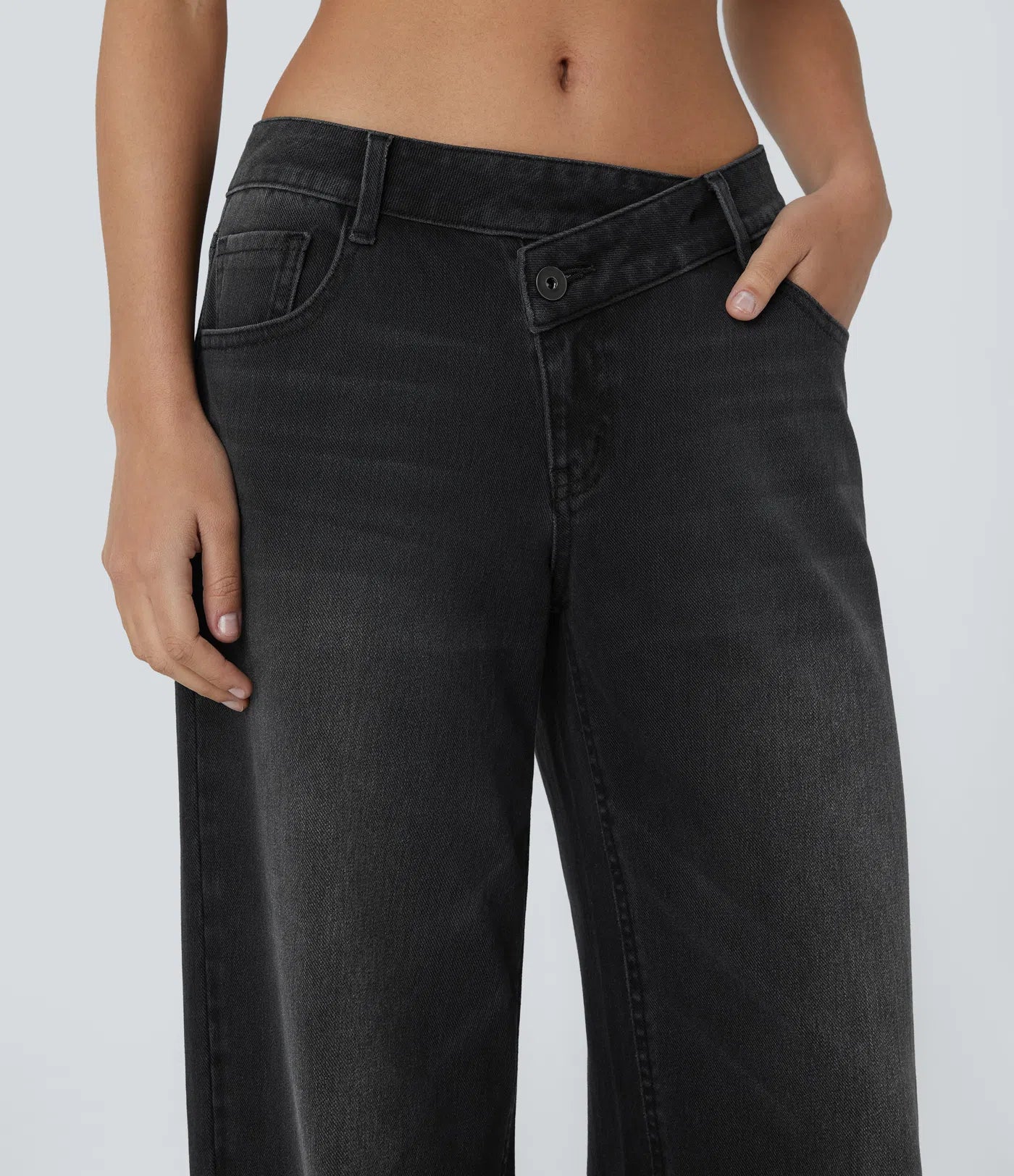 Baggy Flex™ - Jeans casuales anchos de lavado desgastado, tiro bajo, y diseño asimétrico.