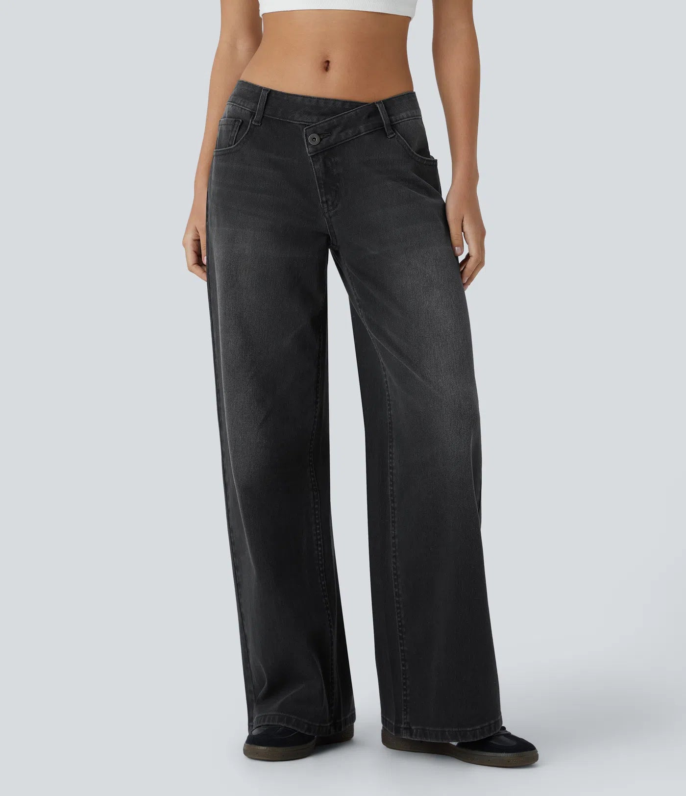 Baggy Flex™ - Jeans casuales anchos de lavado desgastado, tiro bajo, y diseño asimétrico.