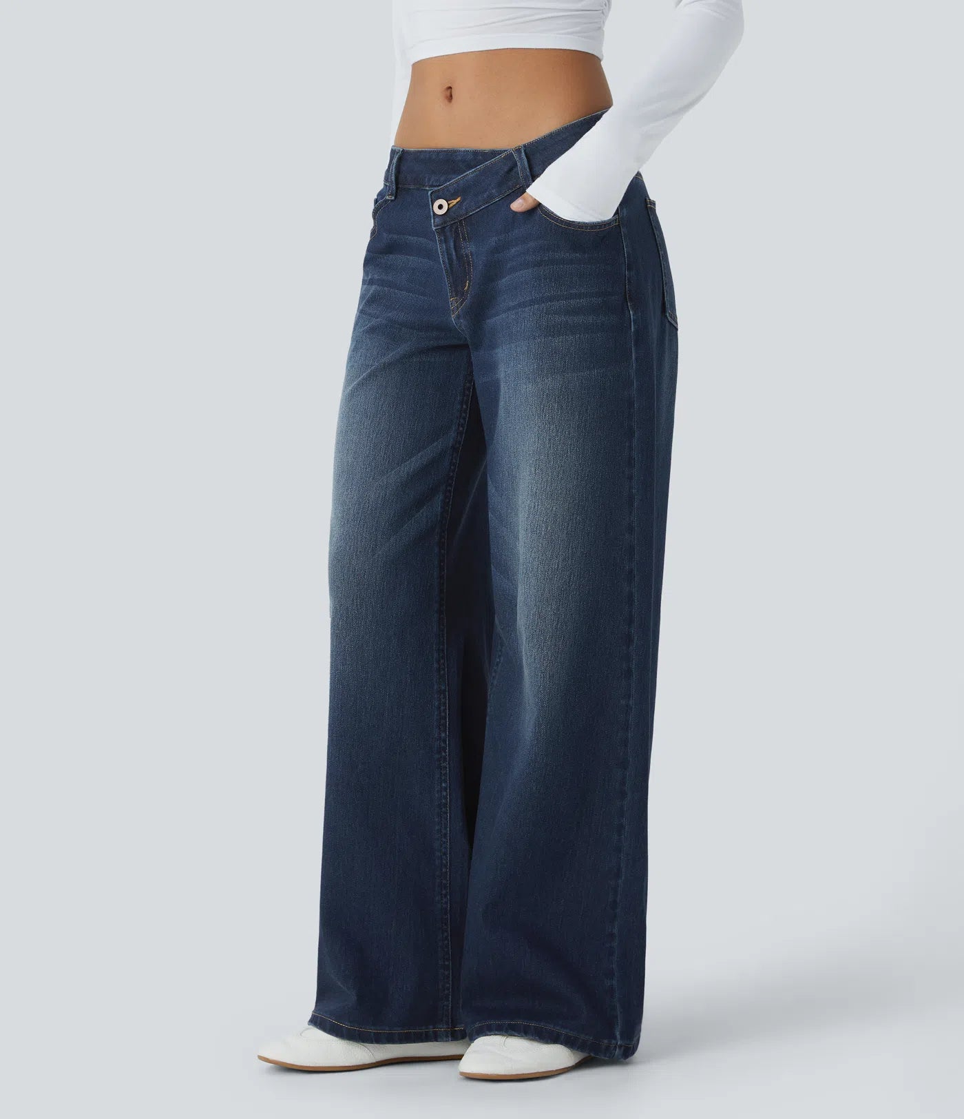 Baggy Flex™ - Jeans casuales anchos de lavado desgastado, tiro bajo, y diseño asimétrico.