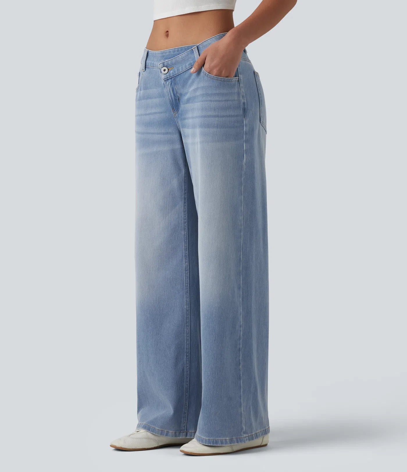 Baggy Flex™ - Jeans casuales anchos de lavado desgastado, tiro bajo, y diseño asimétrico.