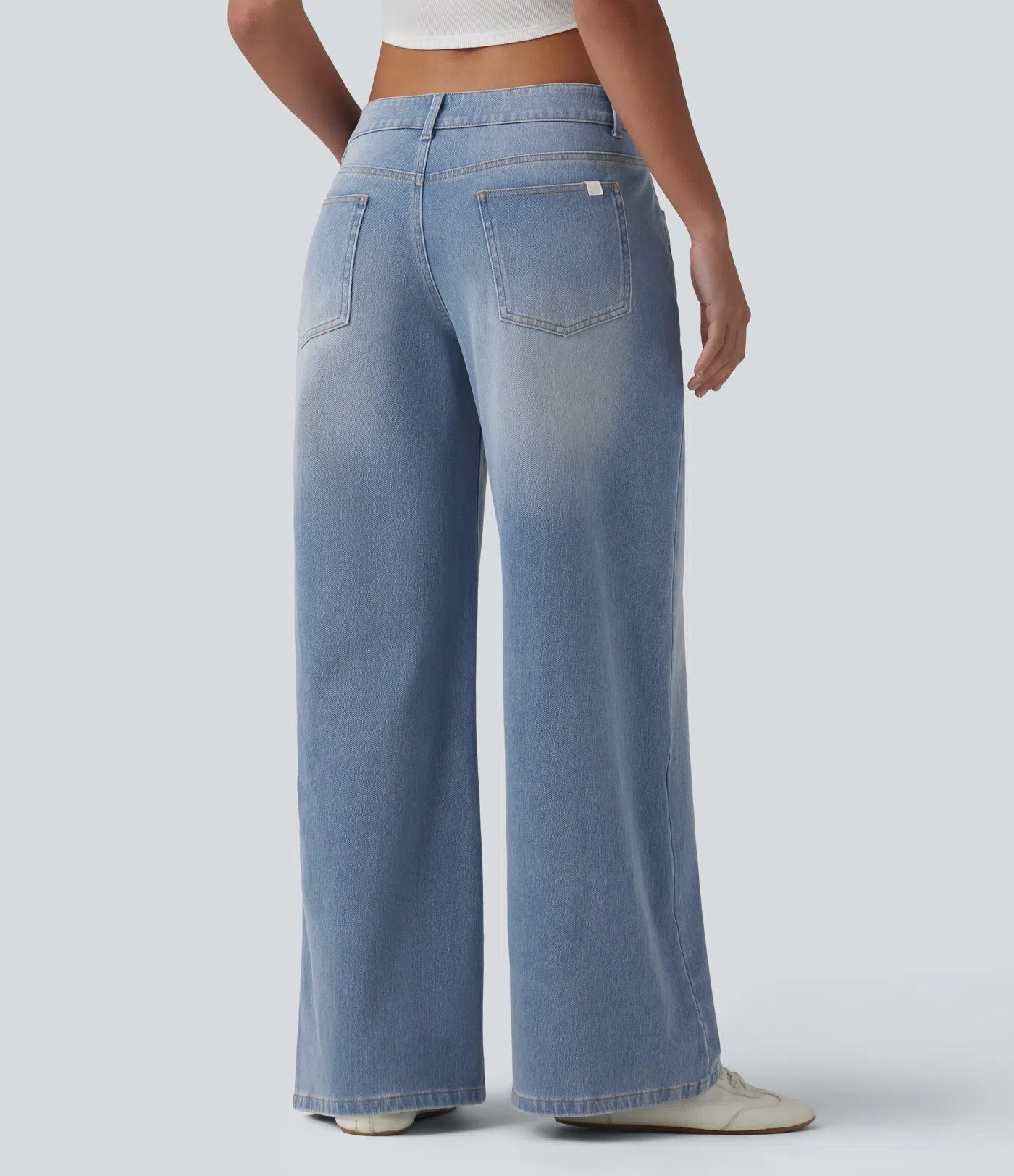 Baggy Flex™ - Jeans casuales anchos de lavado desgastado, tiro bajo, y diseño asimétrico.