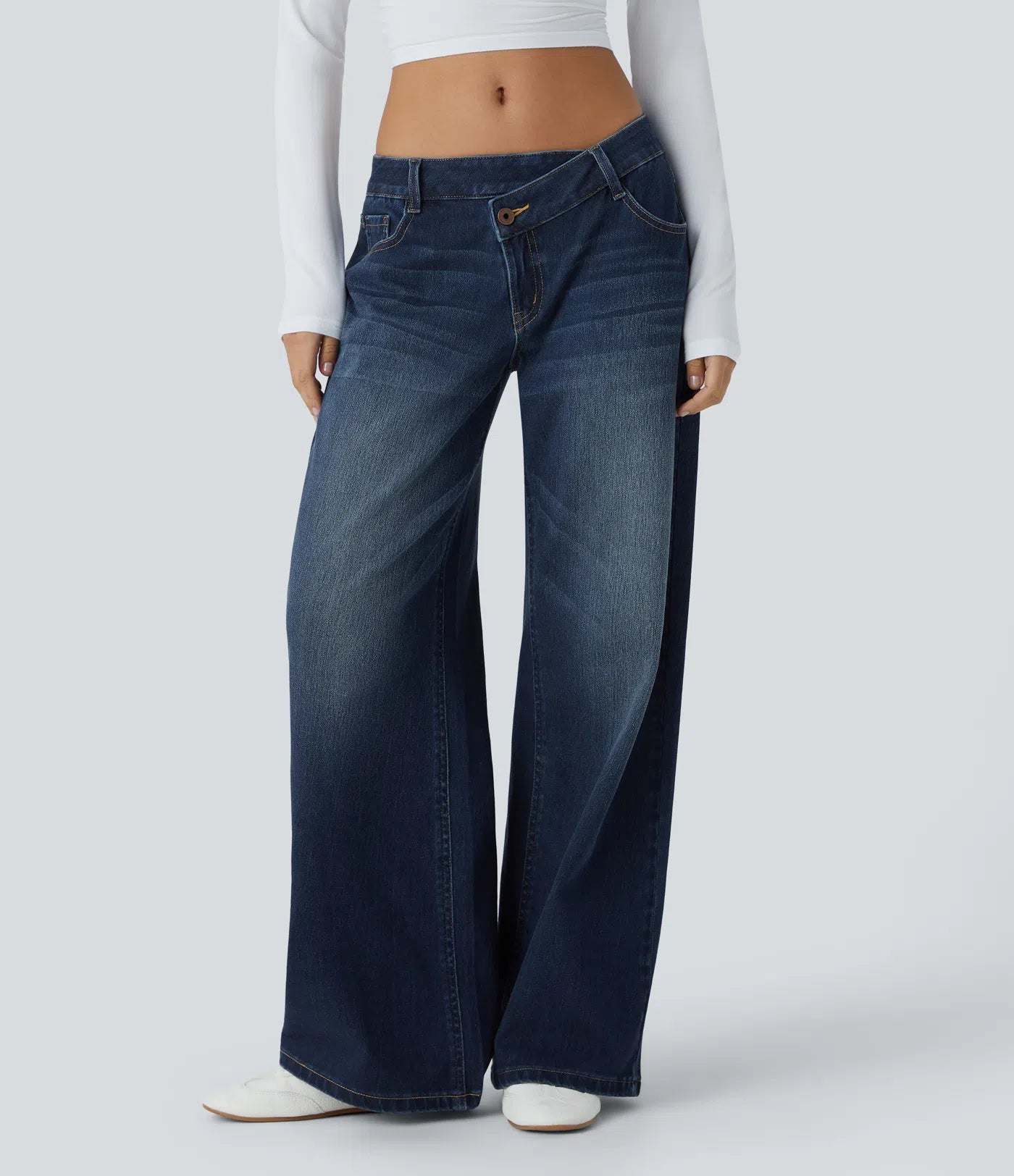 Baggy Flex™ - Jeans casuales anchos de lavado desgastado, tiro bajo, y diseño asimétrico.