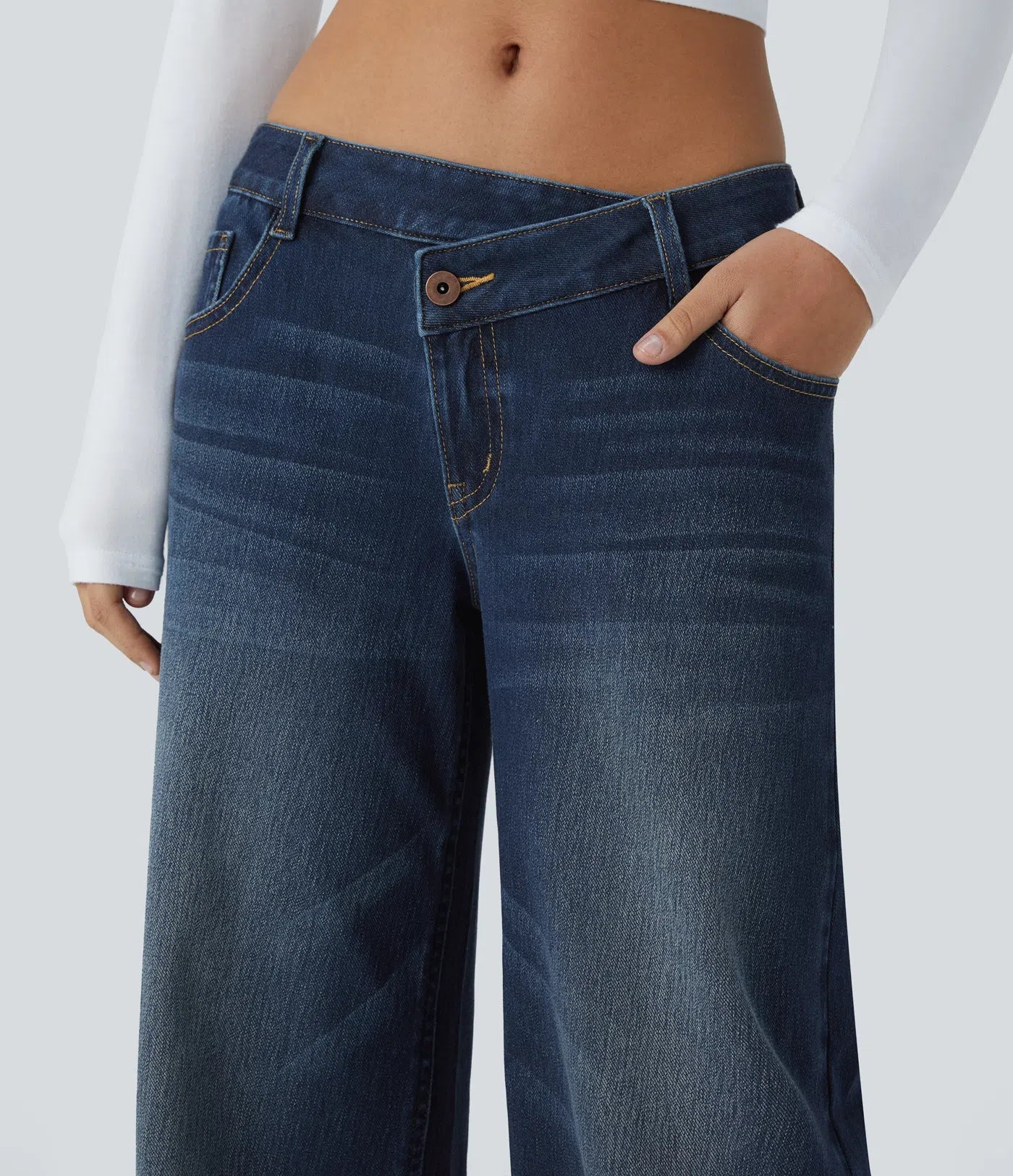 Baggy Flex™ - Jeans casuales anchos de lavado desgastado, tiro bajo, y diseño asimétrico.