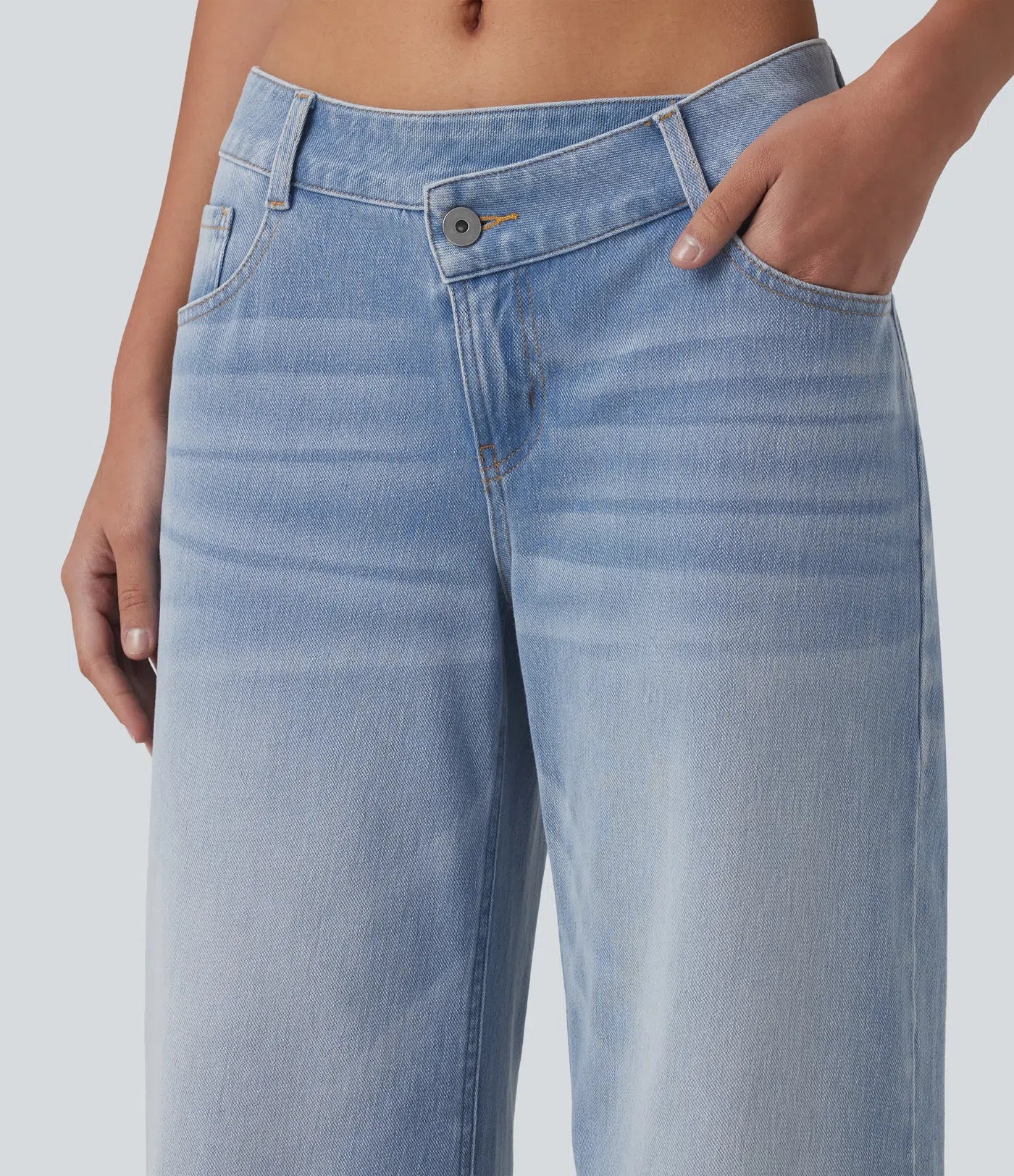 Baggy Flex™ - Jeans casuales anchos de lavado desgastado, tiro bajo, y diseño asimétrico.